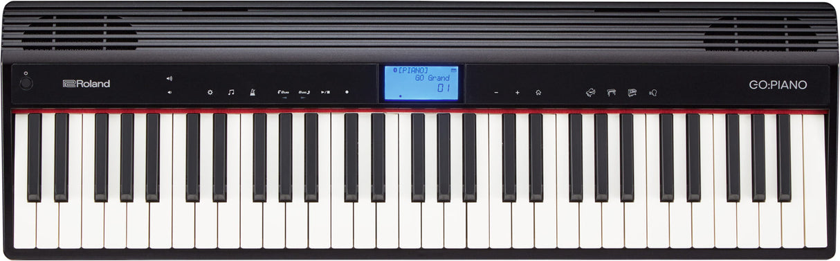 The image shows a Roland GO:PIANO digital keyboard with a full-sized black and white key layout. The control panel features a blue LCD displaying "GO Grand," various buttons for sound selection and volume, and speaker grilles above. The piano has a sleek black, portable design typical of Roland's entry-level GO series, ideal for beginners and casual players seeking a compact, lightweight digital piano.