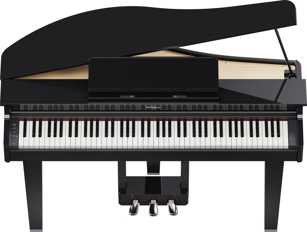 The image shows a Roland digital grand piano with a glossy black finish and curved lid. It features an 88-key keyboard with traditional black and white keys, three pedals, and Roland branding. Designed to mimic an acoustic grand piano’s look and feel, it offers digital benefits like volume control and varied sounds, making it suitable for home or professional use.