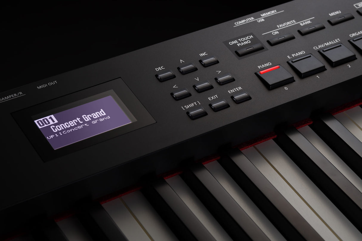 The image shows a digital piano keyboard with black and white keys and red accent lighting. It features a digital display reading "001 Concert Grand" and "UF1 Concert Grand," indicating piano sound presets. The control panel includes navigation, function, mode selection, memory, and setting buttons. A MIDI OUT port is visible, highlighting its connectivity for professional or live use.