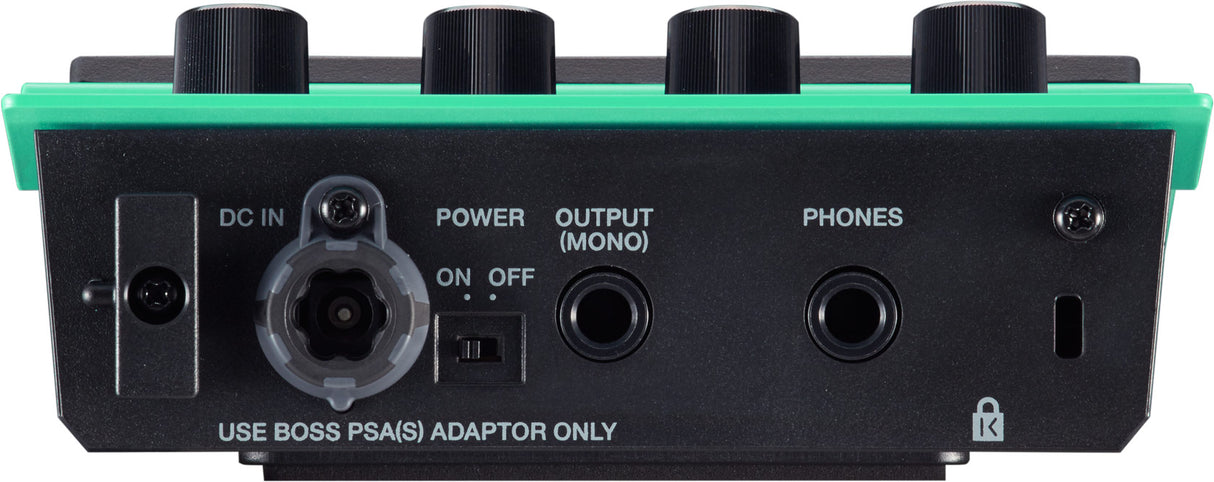 The image shows the back panel of a bright green/teal BOSS guitar effects pedal or multi-effects unit with black control knobs and a black rear panel. Visible features include a DC IN power port with on/off switch, OUTPUT (MONO) jack, PHONES jack, a USB or digital connection port, and a label instructing to use a BOSS PSA(S) adaptor only. This modern digital pedal is designed for guitar sound effects.