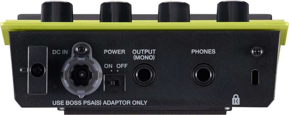 The image shows the rear panel of a BOSS guitar effects pedal, featuring a DC IN power port, OUTPUT (MONO) jack, PHONES jack, and a USB port. It has four black control knobs, a power ON/OFF switch, and the signature yellow-green trim. Text reads "USE BOSS PSA(S) ADAPTOR ONLY" on the black metal casing, indicating BOSS’s proprietary power supply. This is likely a modern multi-effects unit for guitar or bass.