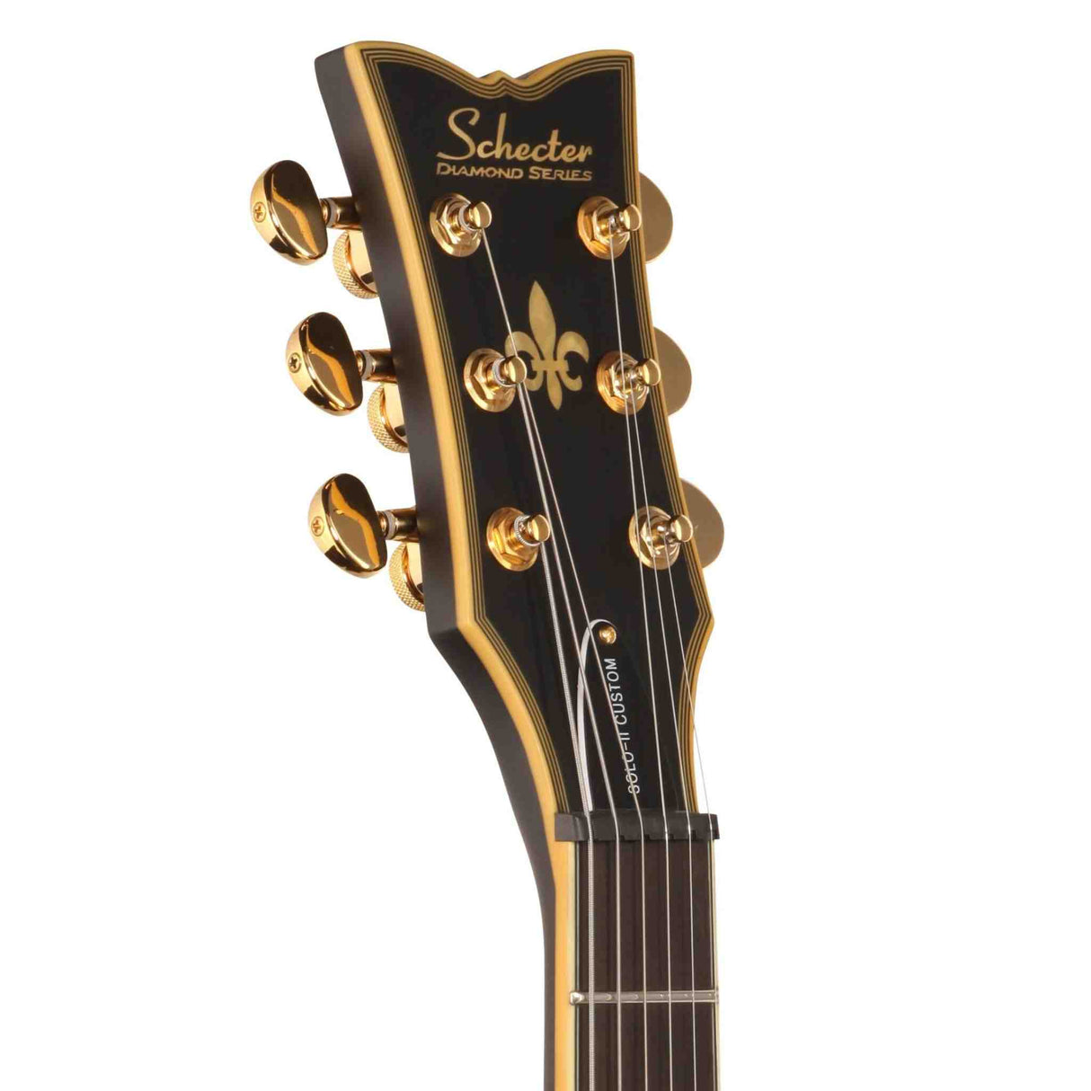 The front of a Schecter Solo II Custom Electric Guitar headstock with gold tuning pegs on a white background