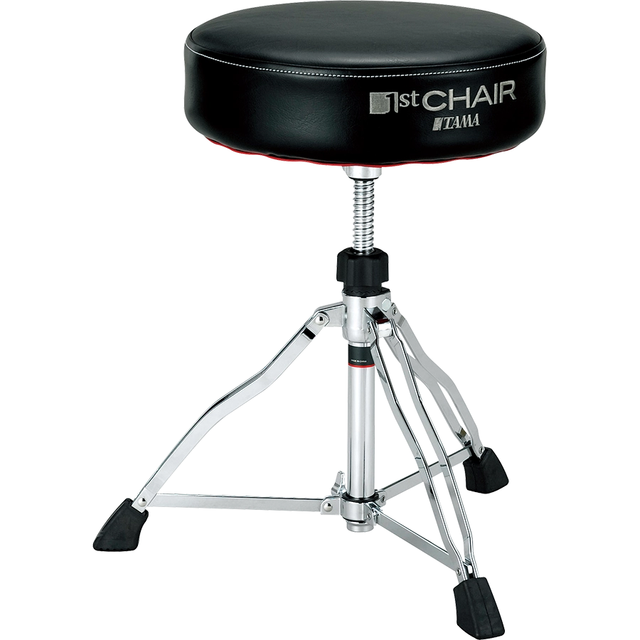 The image shows a Tama drum throne from the "1st Chair" series with a round, padded black vinyl seat. It features an adjustable height threaded rod, a sturdy chrome tripod base with rubber feet for stability, and professional-grade construction. This durable stool provides comfort and optimal seating for drummers during long sessions, reflecting Tama’s reputation for high-quality percussion accessories.
