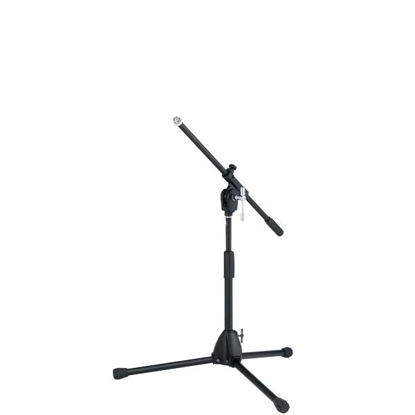 The image shows a professional black microphone stand with a tripod base and an adjustable boom arm. It has multiple height and angle adjustment points with locking mechanisms for stability. This versatile stand is commonly used by musicians, vocalists, and audio engineers to position microphones for recording, live performances, and studio work.