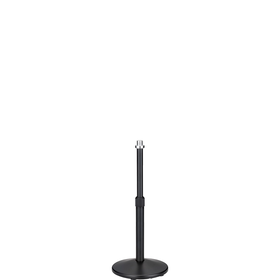 The image shows a black microphone stand with a round, weighted base and an adjustable telescoping pole. It features a microphone clip at the top for holding a microphone. Commonly used in live performances, studios, and broadcasting, the stand’s height adjustment and sturdy base ensure stability and optimal microphone placement for vocals and instruments.