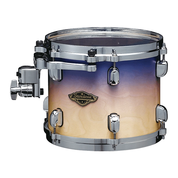 The image shows a mounted tom-tom drum with a gradient finish fading from deep blue to cream. It has chrome hardware, including tension rods, lugs, and a mounting bracket. A "Starclassic" badge on the shell indicates it’s a Tama drum from their Starclassic series. This drum is part of a larger kit, mounted on a stand or rack, with a professional look suitable for stage or studio use.