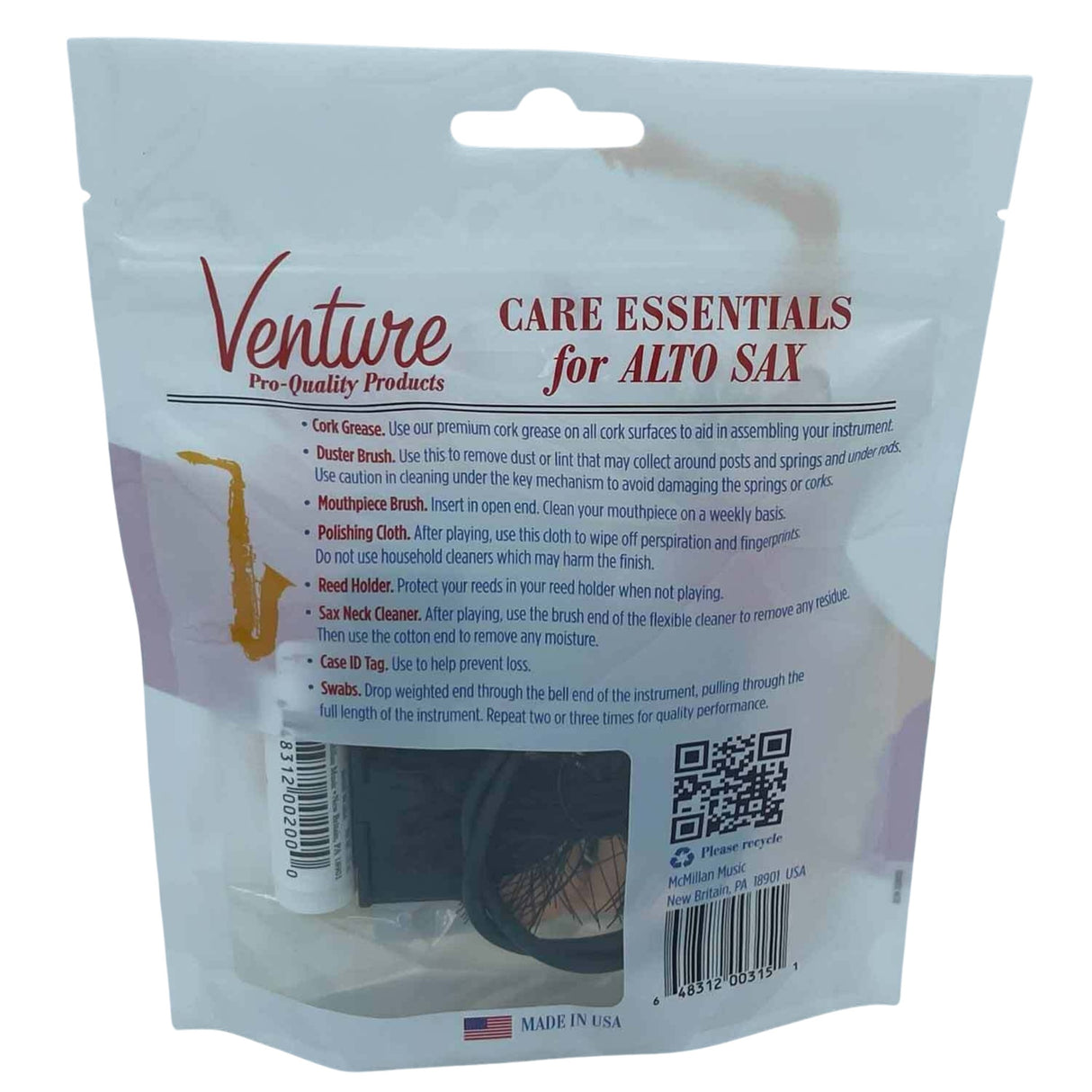 The image shows a Venture Care Essentials kit for Alto Saxophone maintenance. It includes cork grease, duster and mouthpiece brushes, a polishing cloth, reed holder, sax neck cleaner, case ID tag, and swabs. Designed for proper care and gentle handling, this comprehensive kit helps keep saxophones clean and in good condition. Made in the USA, likely by McMillan Music.