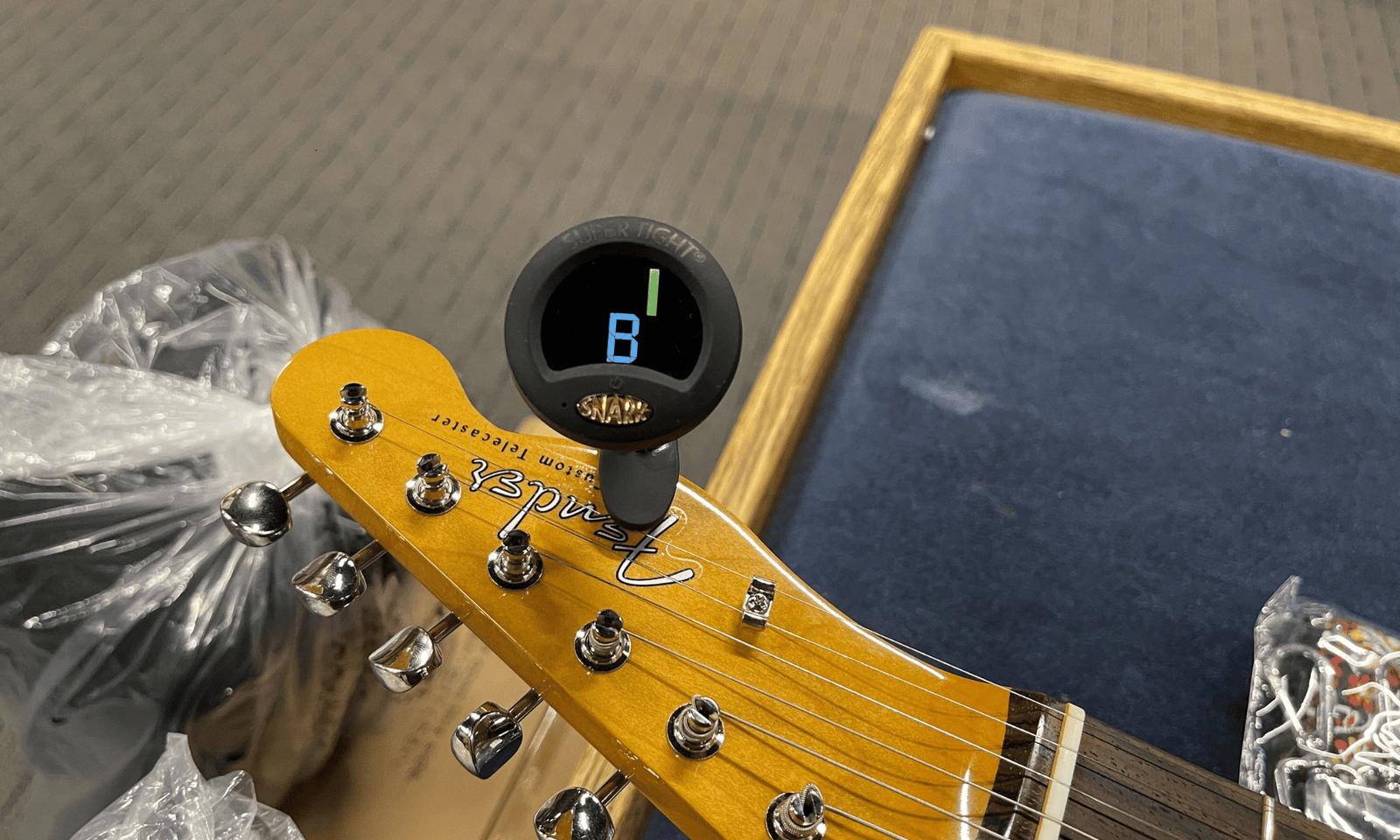 Tuner on guitar headstock