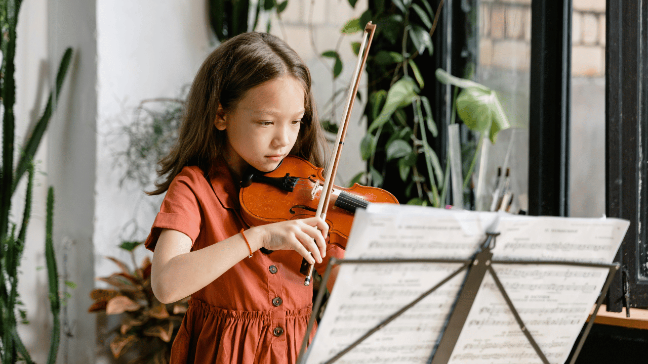 Little girl practicing violin