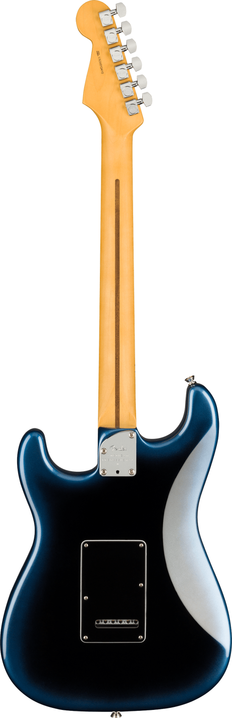 The image shows the back of a Fender Stratocaster-style electric guitar with a natural maple headstock featuring six chrome tuning pegs in a 6-in-line layout and visible Fender branding. The maple neck has a skunk stripe down its center. The deep blue, glossy body has classic Stratocaster contours, a chrome neck plate, and a black plastic back plate covering the tremolo cavity.