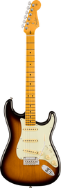 The image shows a Fender Stratocaster electric guitar with a classic double-cutaway body and sunburst finish. It features a cream pickguard, three single-coil pickups with white covers, chrome hardware, and a synchronized tremolo bridge. The maple neck has dot inlays and a natural finish, topped with a Fender headstock and six chrome tuning pegs. This design reflects vintage 1950s-60s Stratocaster styles.