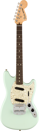 The image shows a Fender Mustang electric guitar with a light seafoam green offset body, white pearloid pickguard, and chrome hardware. It features two single-coil pickups, volume and tone knobs, a chrome vintage-style tremolo bridge, and a natural maple headstock with six chrome tuners. The dark rosewood fretboard has white dot markers. This classic model is known for its shorter scale and distinctive tone.
