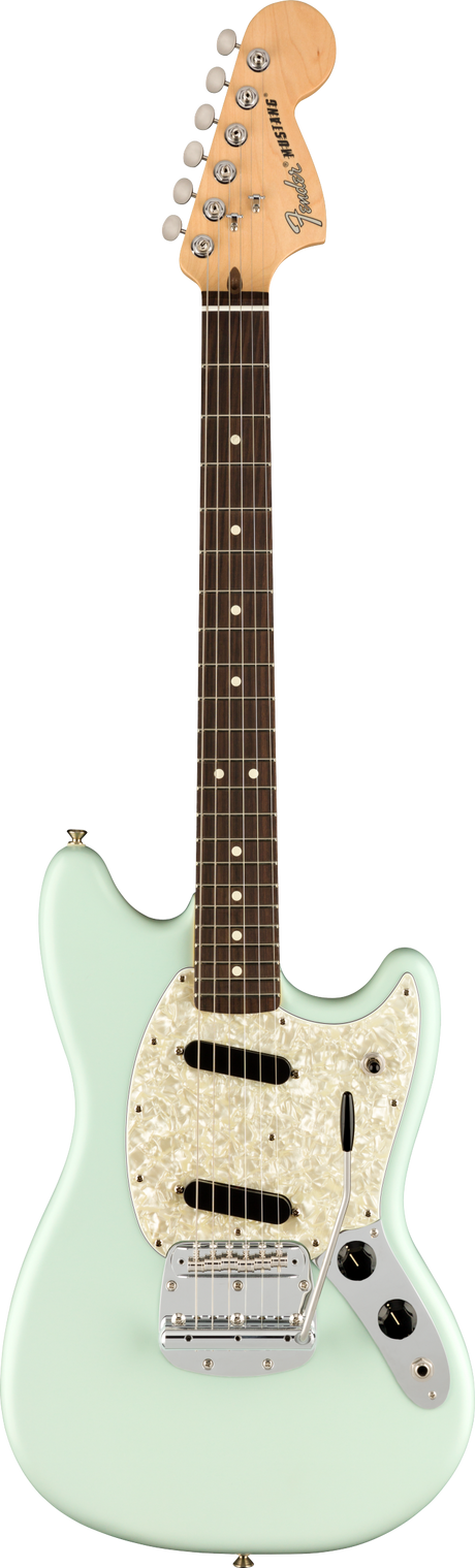 The image shows a Fender Mustang electric guitar with a light seafoam green offset body, white pearloid pickguard, and chrome hardware. It features two single-coil pickups, volume and tone knobs, a chrome vintage-style tremolo bridge, and a natural maple headstock with six chrome tuners. The dark rosewood fretboard has white dot markers. This classic model is known for its shorter scale and distinctive tone.