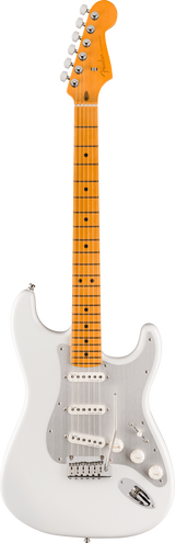 The image shows a classic Stratocaster-style electric guitar with a white/cream solid body, white pickguard, and chrome hardware. It has three white single-coil pickups, a maple neck and fretboard with an amber finish, black dot inlays, and six strings. The headstock features chrome tuning pegs, and the guitar includes a standard tremolo bridge. The warm maple neck contrasts with the white body, creating a vintage-inspired look.
