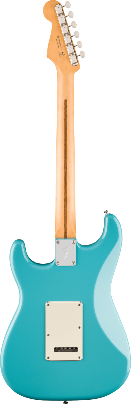 The image shows the back of a Fender Stratocaster-style electric guitar with a turquoise body and white back plate. It has a natural maple neck and headstock with six chrome tuning pegs in a row, a metal neck plate, and chrome hardware. The classic double-cutaway design and vintage finish highlight its timeless appeal, popular across many music genres since the 1950s.
