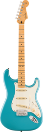 The image shows a Fender Stratocaster electric guitar with a turquoise blue solid body and classic double-cutaway shape. It has a white pickguard, three single-coil pickups with white covers, chrome hardware, a tremolo bridge, and standard controls. The maple neck features dot inlays and a natural finish, topped with the iconic Fender headstock and six chrome tuning pegs with the Fender logo.