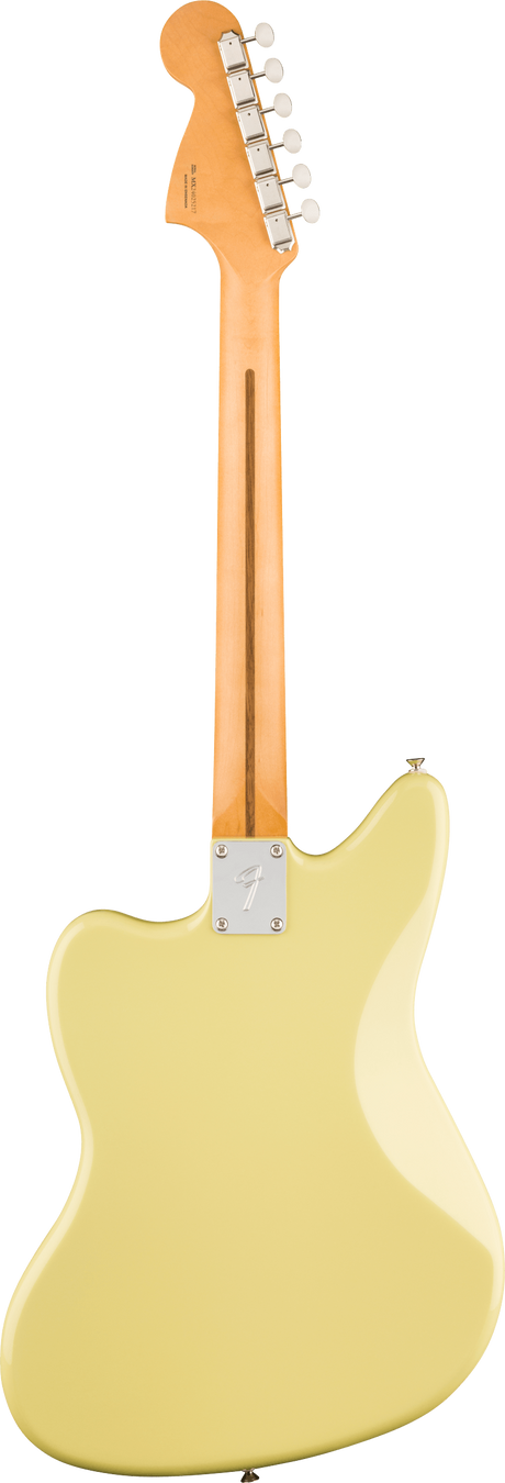The image shows the back of a Fender-style electric guitar featuring a maple neck with a skunk stripe, a metal neck plate with the Fender logo, and a cream or vintage white offset body. The headstock has six inline tuning pegs. The design and bolt-on neck suggest it’s a classic Jazzmaster or Jaguar model, highlighting traditional Fender craftsmanship and vintage aesthetics.