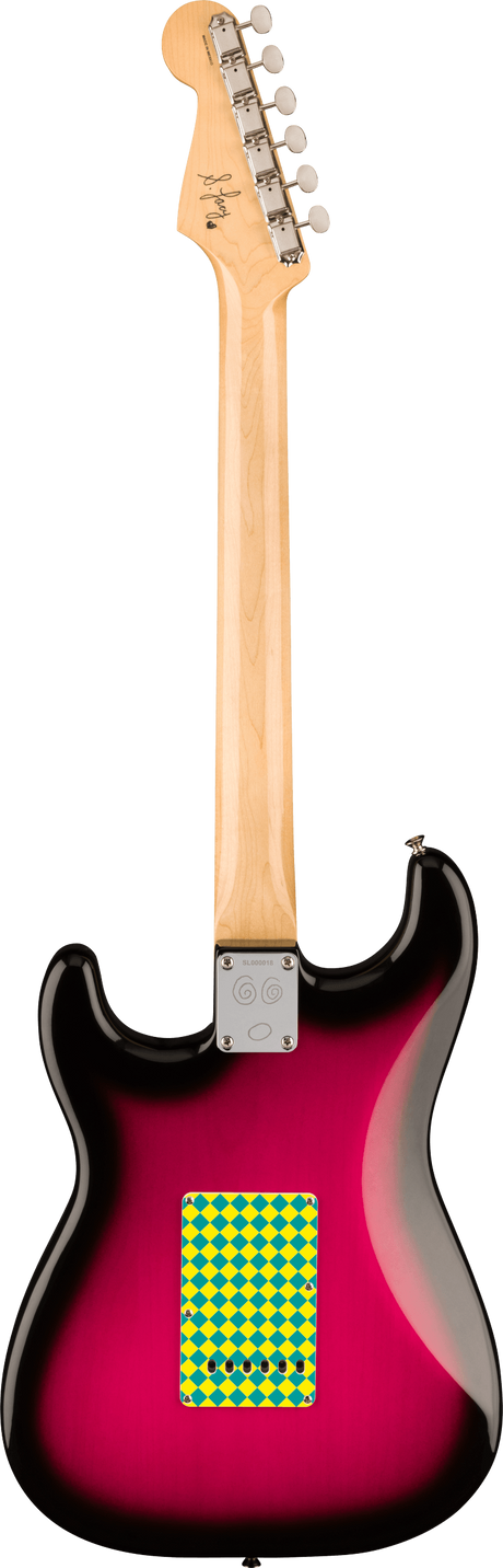 The image shows the back of a Stratocaster-style electric guitar with a natural wood headstock featuring 6 chrome tuning pegs with cream buttons. The neck is light-colored wood, attached to a contoured body with a pink-to-black sunburst finish. A chrome neck plate secures the neck. A small yellow and green diamond sticker is on the lower body. A signature or logo is visible on the headstock, and the guitar has a glossy, high-quality finish.