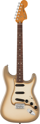 The image shows a classic Fender Stratocaster electric guitar with its iconic headstock featuring "Fender" and "STRATOCASTER" branding. It has six chrome tuning pegs, a contoured double-cutaway body with a sunburst or champagne finish, three single-coil pickups, standard volume and tone controls, a white tremolo bridge, and a rosewood fingerboard with dot inlays.