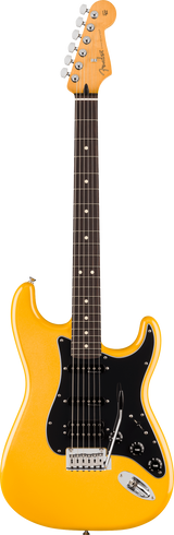 The image shows a Fender Stratocaster electric guitar with a bright yellow-orange glossy finish. It features the classic double-cutaway body, three single-coil pickups with a black pickguard, chrome hardware, and a synchronized tremolo bridge. The maple neck has a rosewood fretboard with dot inlays. The headstock bears the Fender logo and six chrome tuning pegs. This model resembles a vintage reissue of the iconic Stratocaster design.