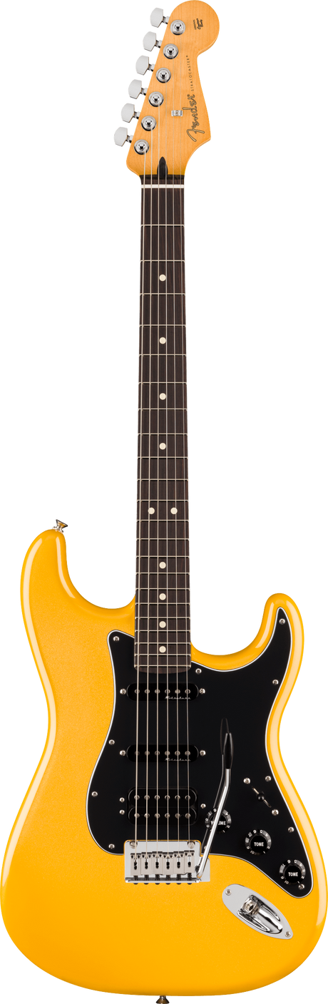 The image shows a Fender Stratocaster electric guitar with a bright yellow-orange glossy finish. It features the classic double-cutaway body, three single-coil pickups with a black pickguard, chrome hardware, and a synchronized tremolo bridge. The maple neck has a rosewood fretboard with dot inlays. The headstock bears the Fender logo and six chrome tuning pegs. This model resembles a vintage reissue of the iconic Stratocaster design.