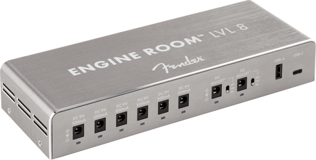 The image shows the Fender Engine Room LVL 8 power supply, featuring 8 isolated 9V outputs with varying milliamp ratings, a compact brushed aluminum metal housing, and USB ports. Designed for clean, stable power, it helps eliminate noise and ground loops, supports diverse pedal power needs, and keeps pedalboards organized. Ideal for medium to large setups, it reflects Fender’s professional build quality.