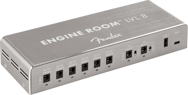 The image shows the Fender Engine Room LVL 8 power supply, featuring 8 isolated 9V outputs with varying milliamp ratings, a compact brushed aluminum metal housing, and USB ports. Designed for clean, stable power, it helps eliminate noise and ground loops, supports diverse pedal power needs, and keeps pedalboards organized. Ideal for medium to large setups, it reflects Fender’s professional build quality.