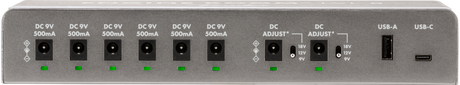 The image shows a power supply unit for guitar effects pedals and pedalboards, featuring six 9V DC outputs (500mA each), two adjustable voltage outputs (9V, 12V, 18V), and USB-A and USB-C ports. It includes LED indicators for power status. This device centralizes power for multiple pedals, reduces cable clutter, ensures clean, isolated power, and supports both vintage and modern digital pedals, making it essential for musicians.