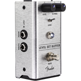 The image shows a Fender Level Set Buffer guitar pedal in a compact brushed aluminum enclosure. It features Level and Hi-Freq knobs, a load switch to simulate amplifier input impedance, Main and Tuner input/output jacks, a mute footswitch for silent tuning, an LED indicator, and Fender branding. This buffer pedal preserves signal integrity over long cable runs and offers tuning and impedance options for guitarists and bassists.