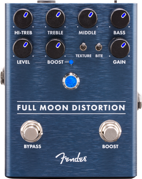 The image shows a Fender Full Moon Distortion pedal with a blue brushed metal finish. It has two rows of knobs for HI-TREB, TREBLE, MIDDLE, BASS, LEVEL, BOOST, and GAIN, plus toggle switches for TEXTURE and BITE. There are dual footswitches labeled BYPASS and BOOST, with blue LED indicators. This high-end pedal offers extensive tone shaping and separate boost control for versatile distortion sounds.