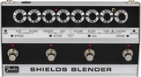 The image shows a vintage Fender Shields Blender guitar effects pedal from the late 1960s/early 1970s. It features eight labeled rotary knobs controlling fuzz, octave, trigger, sag, volume, blend, tone, and sustain. The bottom section has four footswitches with red LEDs for selecting effects modes. The Fender logo and "SHIELDS BLENDER" branding are visible. This multi-effects unit blends sounds and is now a rare collectible.