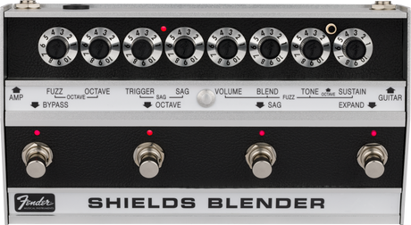The image shows a vintage Fender Shields Blender guitar effects pedal from the late 1960s/early 1970s. It features eight labeled rotary knobs controlling fuzz, octave, trigger, sag, volume, blend, tone, and sustain. The bottom section has four footswitches with red LEDs for selecting effects modes. The Fender logo and "SHIELDS BLENDER" branding are visible. This multi-effects unit blends sounds and is now a rare collectible.