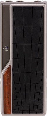 The image shows a Fender volume/expression pedal with a sleek gray metal housing and a large black textured footplate. It features the Fender logo on a wooden panel and an ON/OFF LED switch. The rocker-style design lets guitarists control volume or effects parameters like wah and delay for dynamic, expressive playing. Fender is a trusted brand known for quality guitar gear.