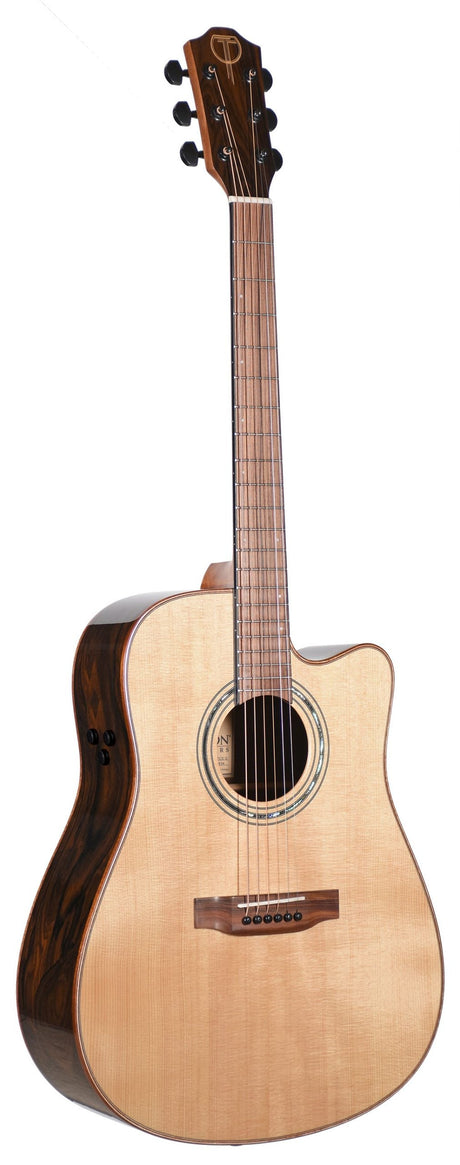 The image shows a dreadnought-style acoustic-electric guitar with a single cutaway. It features a light-colored spruce top, darker rosewood back and sides, and a round soundhole with a decorative rosette. The neck has a light fretboard with markers, and the headstock has black tuning pegs arranged 3x3. Control knobs on the side indicate built-in electronics for amplification.