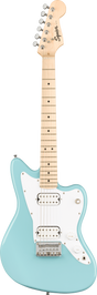 The image shows a Squier electric guitar modeled after the Fender Jazzmaster. It features a light blue/seafoam green body, white pickguard, two white-covered humbucker pickups, a maple neck with dot inlays, chrome tuning pegs, and traditional Jazzmaster offset body shape. The headstock displays the Squier logo. The hardware includes a chrome bridge and tailpiece, with standard volume, tone, and pickup controls, reflecting a vintage-inspired, affordable Fender design.