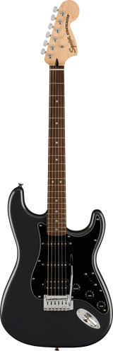 The image shows a Squier Stratocaster electric guitar with a black solid body and gloss finish. It features a maple neck with a rosewood fretboard, chrome 6-inline tuners, and visible Squier branding on the headstock. The guitar has three single-coil pickups with white covers, a black pickguard, standard Stratocaster controls, a 5-way switch, and a synchronized tremolo bridge. This budget-friendly model retains classic Strat design and playability.