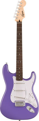 The image shows a Squier Stratocaster-style electric guitar with a glossy purple body, white pickguard, and three single-coil pickups. It has a maple neck with a dark rosewood fretboard and white dot inlays. The headstock features the Squier logo and six chrome tuning pegs. White pickup covers and control knobs complement the chrome tremolo bridge. This entry-level model offers classic Fender style and sound with a vibrant finish.