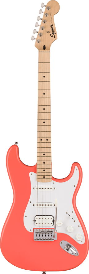 The image shows a Squier Stratocaster-style electric guitar with a coral pink contoured body and white pickguard. It features three pickups—two single-coils and a humbucker at the bridge—chrome hardware, a maple neck and fretboard with black dot inlays, and six-in-line chrome tuners. The Squier logo is visible on the headstock. This guitar offers a classic Fender look at an affordable price.
