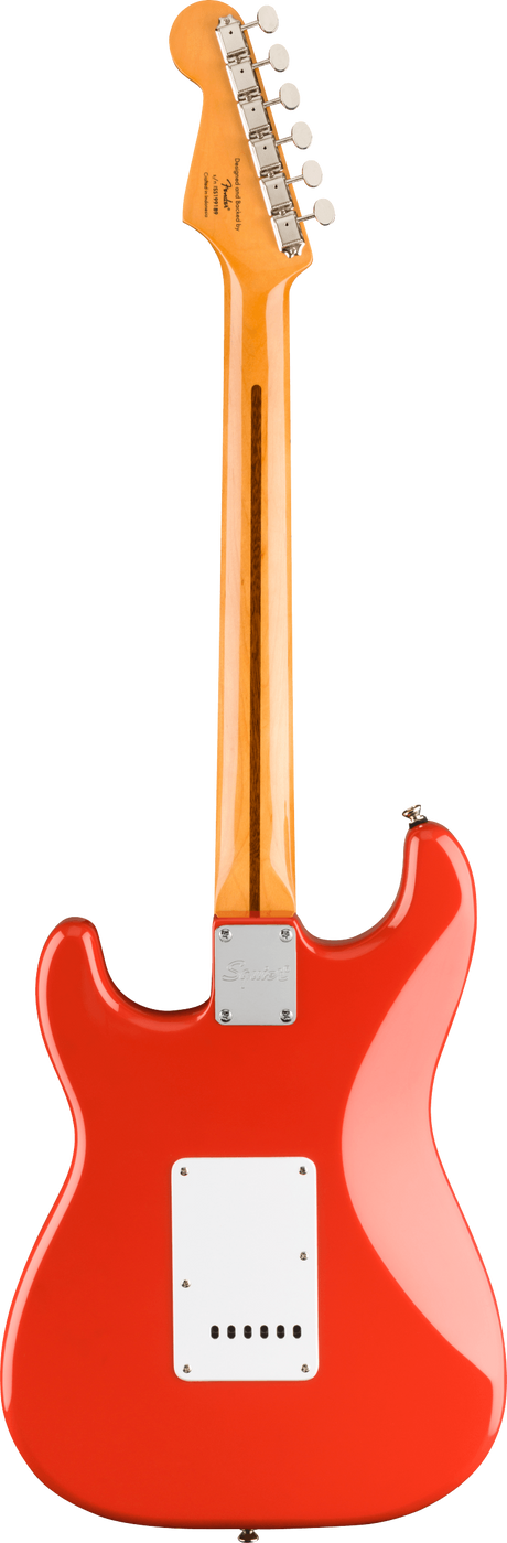 The image shows the back of a bright red/orange Stratocaster-style electric guitar with a glossy finish. It features a contoured body, white plastic back plates, and a bolt-on natural maple neck. The light-colored headstock has six chrome tuning pegs and visible branding. A metal neck plate secures the neck to the body, highlighting the clean, classic design and quality craftsmanship typical of this iconic guitar style.