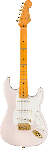 The image shows a Squier Stratocaster-style electric guitar with a light pink body and white pickguard. It features gold hardware, three single-coil pickups, standard controls, and a tremolo bridge. The maple neck has dot inlays, a natural finish, and six tuning pegs. The headstock displays the Squier logo. This higher-end Squier model combines vintage-inspired pink and gold aesthetics with Fender-style playability.