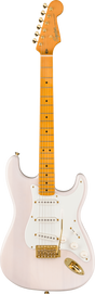 The image shows a Squier Stratocaster-style electric guitar with a light pink body and white pickguard. It features gold hardware, three single-coil pickups, standard controls, and a tremolo bridge. The maple neck has dot inlays, a natural finish, and six tuning pegs. The headstock displays the Squier logo. This higher-end Squier model combines vintage-inspired pink and gold aesthetics with Fender-style playability.