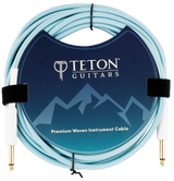 The image shows a Teton Teal 20ft guitar cable from the front, highlighting its teal-colored, coiled cable with metal connectors on both ends. The connectors have a durable, sleek design, and the cable appears flexible yet sturdy, suitable for professional guitar use. The background is plain, emphasizing the cable’s features and vibrant color.