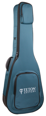 The image shows a teal/blue Teton Guitars padded gig bag shaped for acoustic guitars. It features the "TETON GUITARS" logo on the front pocket, multiple zippered compartments, padded shoulder straps, black zipper trim, and durable fabric. Designed for safe, lightweight transport, this soft case is ideal for carrying acoustic guitars and complements Teton’s branded instruments.