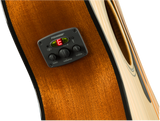 The image shows a close-up of an acoustic guitar’s side featuring a Fishman preamp/EQ system. It includes a digital tuner displaying "E," three control knobs labeled bass, volume, and treble, and the Fishman logo. The guitar has a rich amber wood grain with natural binding. This electronic setup enables amplification while preserving the acoustic tone and offers on-board tuning, ideal for live performance and recording.