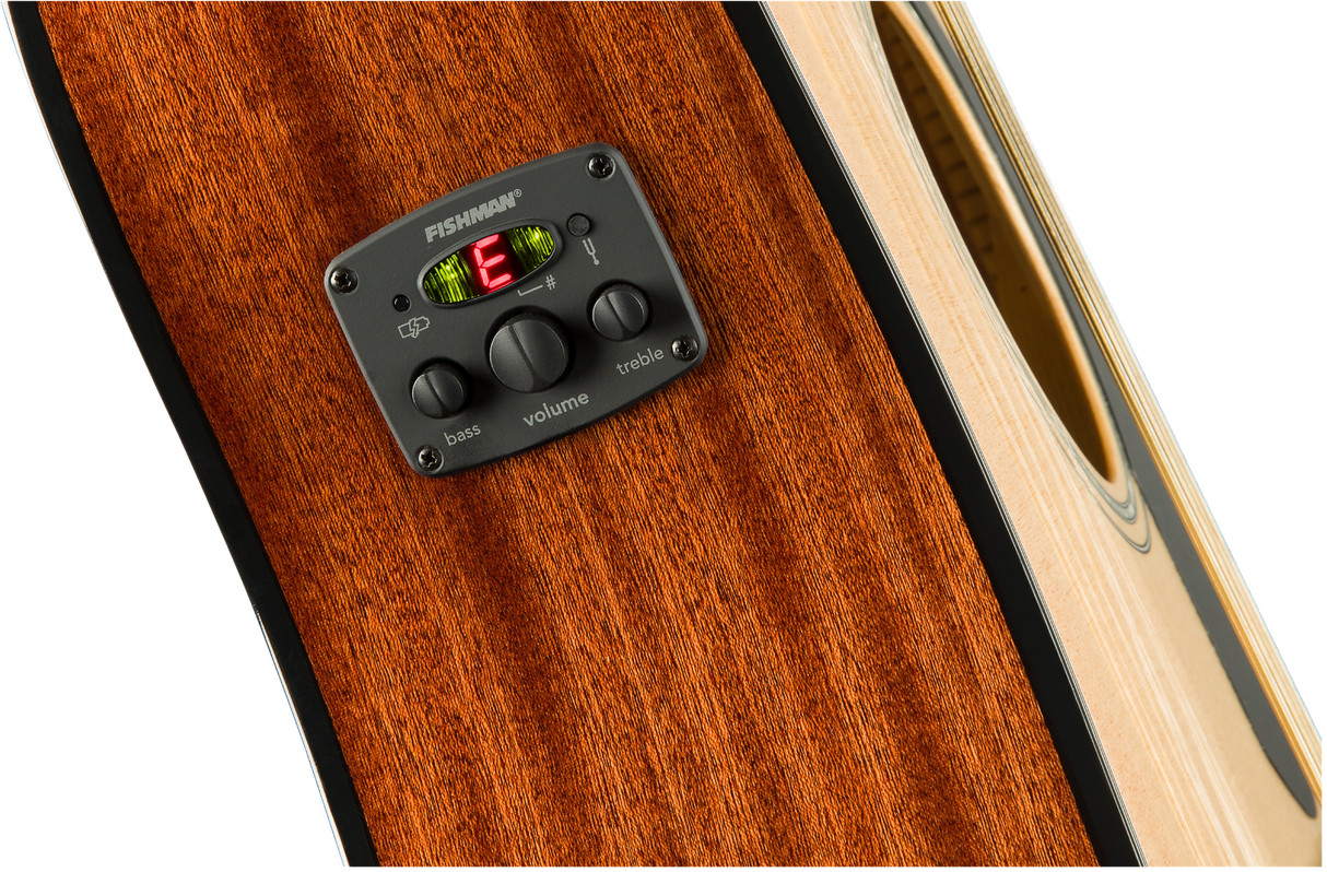 The image shows a close-up of an acoustic guitar’s Fishman preamp/EQ system mounted on its side. It features three control knobs for bass, volume, and treble, along with a built-in digital chromatic tuner with LED indicators. The guitar’s rich amber wood grain and part of the sound hole edge are also visible. This setup allows amplified play while preserving the guitar’s acoustic tone.