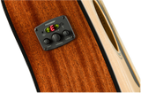 The image shows a close-up of an acoustic guitar’s Fishman preamp/EQ system mounted on its side. It features three control knobs for bass, volume, and treble, along with a built-in digital chromatic tuner with LED indicators. The guitar’s rich amber wood grain and part of the sound hole edge are also visible. This setup allows amplified play while preserving the guitar’s acoustic tone.