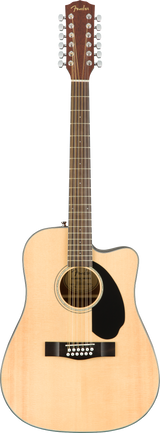 The image shows a Fender 12-string acoustic guitar with a natural blonde finish and dreadnought body. It features 12 strings in six pairs, a black teardrop-shaped pickguard, and 12 gold tuning pegs on the headstock with Fender branding. The cutaway design allows easier access to higher frets, suggesting it is an acoustic-electric model. The paired strings create a rich, shimmering sound typical of 12-string guitars.