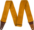 The image shows a guitar strap made of golden yellow corduroy with a ridged texture and brown leather ends, one embossed with a Fender logo. It features an adjustable metal slide buckle and a vintage-inspired design. This strap combines style and function, supporting the guitar when playing standing up while adding a retro, fashionable look.