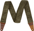 The image shows a guitar strap made of olive green corduroy fabric with ribbed texture and brown leather end tabs. It features an adjustable slider mechanism and a "Fender" logo embossed on one leather end. Designed for comfort and durability, the strap securely attaches to guitars, making it suitable for both acoustic and electric instruments.
