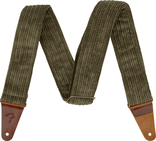 The image shows a guitar strap made of olive green corduroy fabric with ribbed texture and brown leather end tabs. It features an adjustable slider mechanism and a "Fender" logo embossed on one leather end. Designed for comfort and durability, the strap securely attaches to guitars, making it suitable for both acoustic and electric instruments.